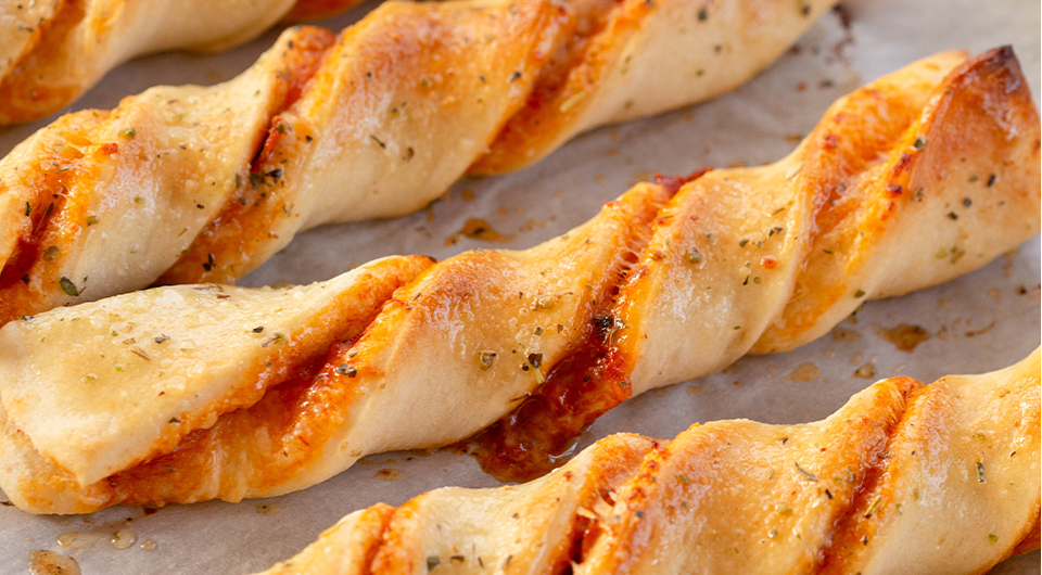 Twisted Pizza Breadsticks with Marinara Sauce