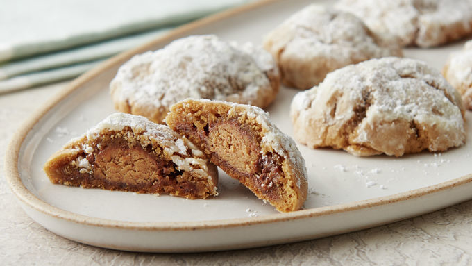 Peanut Butter Cup-Stuffed Snowball Cookies